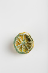 ugly lemon with mold on white background