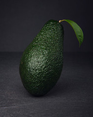 Fresh, raw avocado on a black background