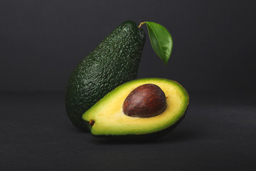 Fresh, raw avocado on a black background