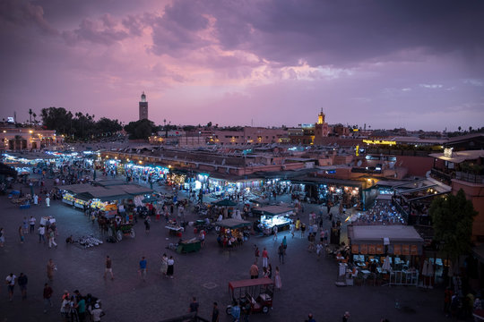 Djema el Fna, traditional market in Marrakech, Morocco, just before thunderstorm, violet sky 