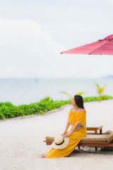 Portrait beautiful asian woman wear hat with smile happy leisure on the beach sea ocean in holiday vacation