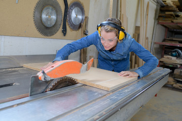 woman using a circular saw