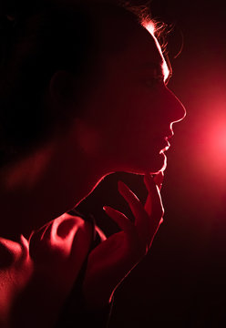 Girl On The Night Out. Red, Fluorescent Color Of The Light In The Club