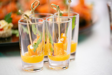 Mango with honey. Buffet at the gala dinner. Assortment of canapes. Banquet service.