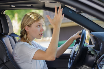 stressed woman during traffic jam