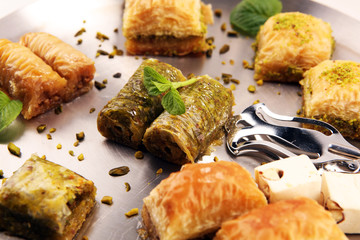 Middle eastern or arabic dishes. Turkish Dessert Baklava with pistachio on dishes