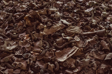 Gas masks, respirator in destroyed abandoned ghost city Pripyat ruins after Chernobyl disaster....