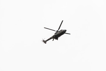 Fototapeta na wymiar Military navy helicopter flying isolated on white background