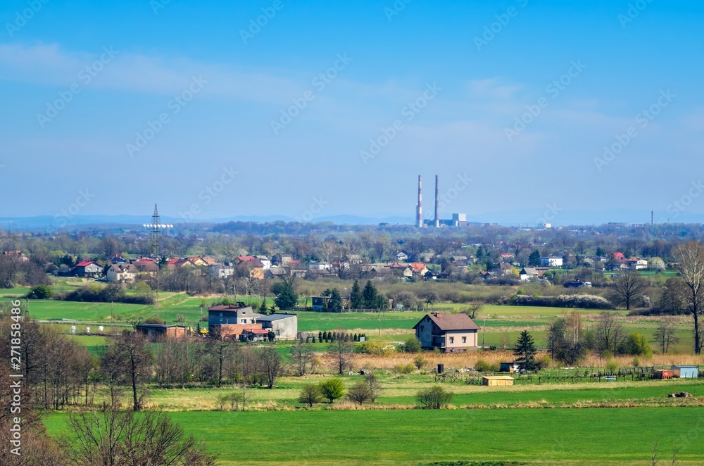 Wall mural spring urban landscape. houses in the countryside in poland.