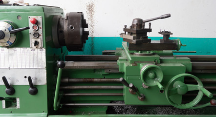 green lathe machine in factory