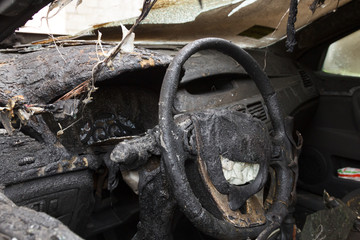 passenger compartment after the fire, partially burned down parts of the car