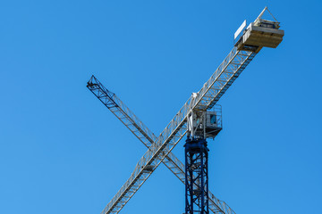 Fototapeta na wymiar image of a tower crane at the construction site of a residential house