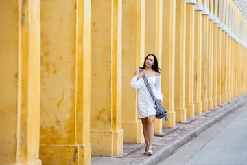 Beautiful woman walking around the walled city in Cartagena de Indias