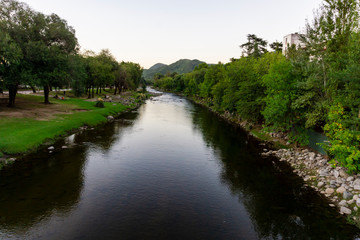 Scene view of Calamuchita river during summer sunset