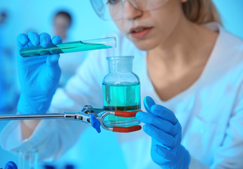 Medical student working in modern scientific laboratory, closeup