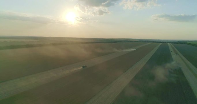 Farm machinery gathering barley