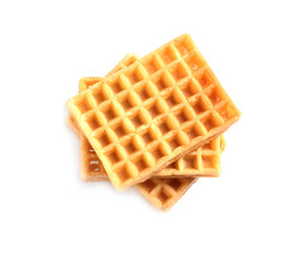Delicious waffles for breakfast on white background, top view