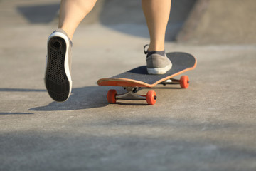 skater legs skating at skatepark