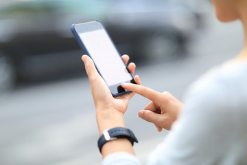 Woman use smartphone at city