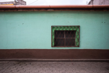 Green and Brown Wall with Window in Guatemala