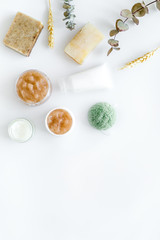 Natural herbal cosmetics with wheat on white background top view space for text