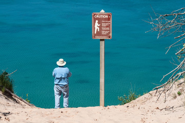 Man on the shore of Lake Superior on the upper peninsula of Michigan 