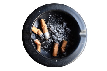 cigarette in an black ashtray on white background