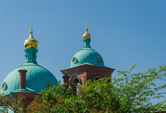 Beautiful domes of the Orthodox church against the blue sky. Resurrection skete of the Valaam Monastery. Church of the Resurrection of Christ. Valaam Island. Karelia. Russia.