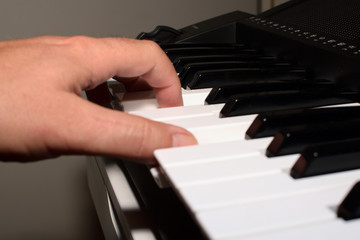 Fototapeta premium piano keys on black background, look at the keys of a keyboard