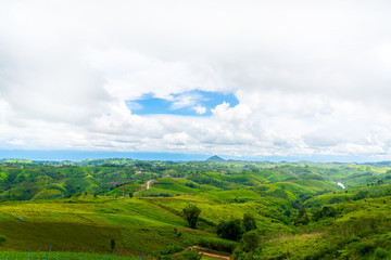Obraz premium Blue sky high peak mountains fog hills mist scenery national park views at Phu Tub Berk, Khao Koh, Phetchabun Province, Thailand
