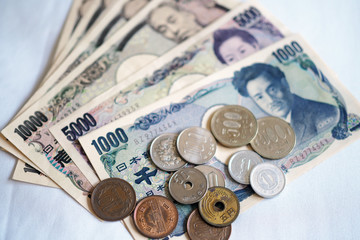 Japanese yen notes and Japanese yen coins for money concept background