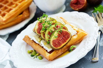 Homemade waffles with caramel sauce, figs and raspberries.