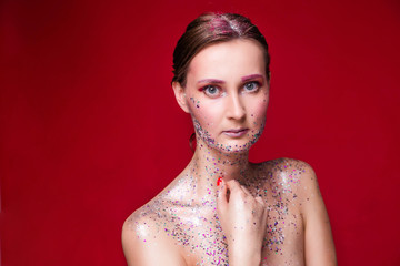 Fashion model woman with trendy glitter make-up