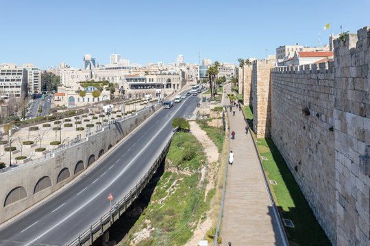 View from the city wall to Khativat Yerushalayim street passing near Jaffa Gate and the fortress walls city walls in old city of Jerusalem, Israel