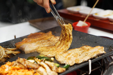 Korean grilled pork belly BBQ (Samgyeopsal Gui) - The popular Korean barbecue dish, served with...
