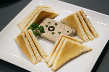 Homemade chicken liver pate with cognac and fresh green peppercorns, Served with crispy toasts.