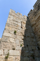 Fototapeta na wymiar Fragment of the city wall near to Damascus Gate in the old city of Jerusalem, Israel