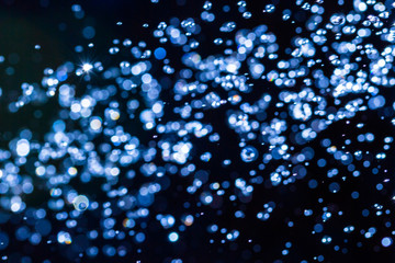 Abstract blue bokeh on black