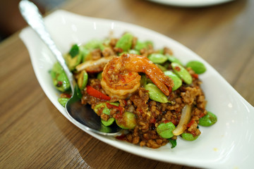 Stir-Fried Twisted cluster bean (Bitter bean or Stink bean) with shrimps paste, Traditional Thai food recipe, Popular in Thailand.
