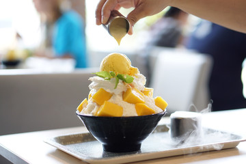 Mango Bingsu (Kakigori) - Korean shaved ice dessert flavor, stuffed with sticky rice, topped with...