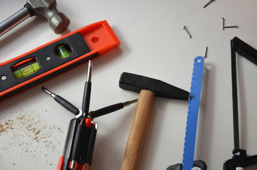 professional builder work with house renovation instruments on white background top view