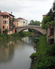 Fototapeta na wymiar river called Retrone in Vicenza City in Italy and the ancient Br