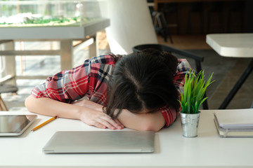 woman sleeping at workplace. girl tired from hard work