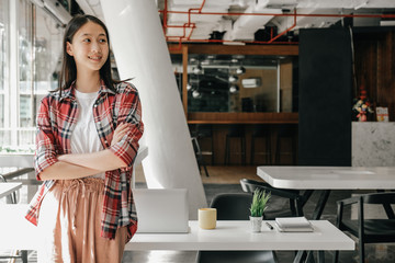 asian girl teenager posing at co-working space