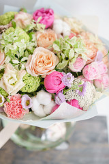 delicate, pastel coloured Small Beautiful bouquet of mixed flowers. Floral shop concept . Beautiful fresh cut bouquet. Flowers delivery