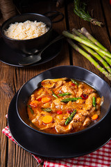 colorful turkey fricassee with asparagus and paprika