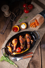 grilled chicken legs in barbecue marinade with sweet potatoes