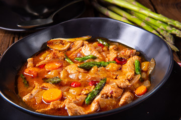 colorful turkey fricassee with asparagus and paprika