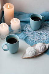 A break for two: cups of coffee and a plate of zefirs.