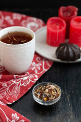 A tasty break: a cup of tea and a glazed zefir.